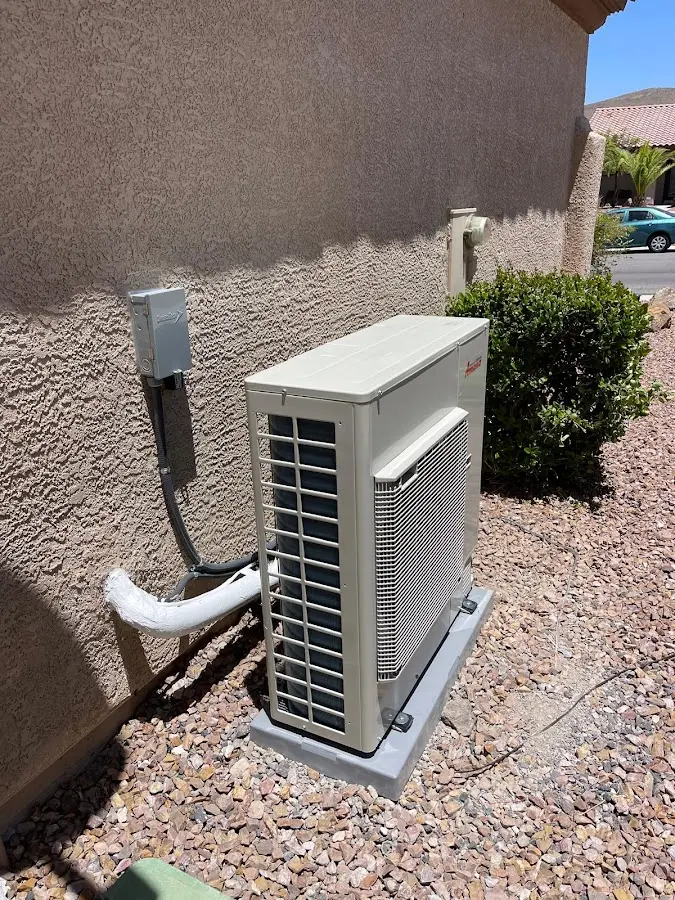 Residential air conditioning condenser unit in Green