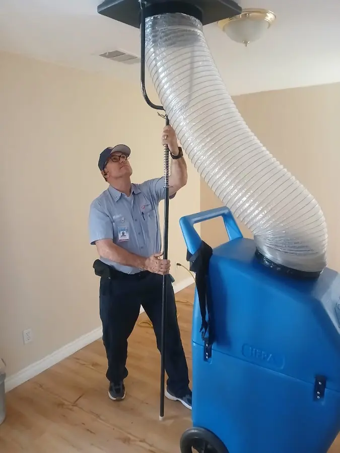 HVAC Installation technician using HEPA equipment in Green